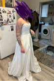 This dress is everything I wanted and more. The quality is just as good as the $1300 dress I was going to buy from a bridal shop in my hometown. It fits like a glove and I won't need any alterations. I do want to note that I am NOT busty. If you are, and in between a medium and a large I would size up. - Andrea V.