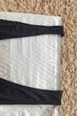 I wore this top without looking at it too close, and then it was pointed out to me that one of the straps was much thinner than the other. Embarrassing! There was clearly a sewing issue. Had the same problem with the white version. Wish I could still return. - Jennae J.