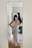 This dress is seriously beautiful. I actually couldn't believe how nice it was when I took it out of the box. Ultimately it felt a little too 1920s-themed and I went with another lulus dress. But if that's the style you're going for then 100% buy it! Runs a little big, definitely size down. - Shannon M.