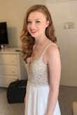 Last March I got married in this dress. It was perfect!! The beaded top is gorgeous and I was impressed with the quality of it. I am short (5'2") so I needed to hem almost 6 inches off the bottom and I also have a smaller bust so I needed some alterations with the strap length but overall it fit great. If you are considering this dress, pull the trigger and get it, you won't be sorry! - Meg W.