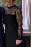 I bought this top to go over a formal black strapless dress which i was wearing for a winter wedding.  I wanted simple and sleek and that would cover my arms since i am always cold.  

I loved the sheer fabric, the lace and detail, along with the mock neck.  It was scalloped at the edge of the shirt around my waste and at the arms.  The arms ran a little long on me, because i am very short and this is not a petite top, but it wasnt by a lot and hardly noticeable.  

The fabric was soft and comfortable. It was not itchy at all. - Danielle F.