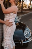 I bought this dress to wear for my engagement photos and it was perfect. Downside: The straps are elastic so there was not much support for larger chests, I fixed this with a supportive strapless. The belly band was a tad snug but overall fits true to size. - Cortney H.