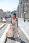 I got this to wear for a castle photo shoot in Budapest and couldn't have been happier. It is a little small in the chest at least for me and too long even with heels but has such a good flow. I got so many compliments.   I'm usually a size 0-2/xs-s and I'm 5'5" and got the small. - Lindsay W.