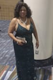 This was an absolute gem of a dress. It has enough details in the sparkle to look elegant but was simple at the same time. No shedding but lots of sparkle. It is lightweight and wasn't uncomfortable as some formal wear can be. It was priced right as I tried on similar dresses at a much higher price. It fits as expected except am top-heavy so I size up to accommodate. I like that the straps are adjustable. One broke but that's due to over dancing not workmanship. I don't usually wear green but I received a ton of compliments and felt the dress was worthy of each one. Would order again in another color. - Rona H.