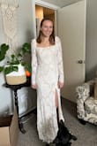 It fit me perfectly and it was the most comfortable dress I tried on. I love the puffed sleeves (length was perfect), the neck line, and the slit. I like how the slip is nude rather than white. I wanted something a little more fancy so I didn't keep it, but this was a close call for my wedding dress. - Carlie W.