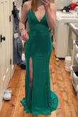 It fits true to size, and it's also adjustable because of the back. The material is very nice. It's a very flattering dress! In the picture, it looks more teal, but in person, it's more green. - Mikyla H.