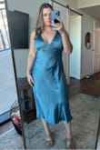 Love this dress and it's so flattering on and the color is amazing. The material is nice and thick satin. My one complaint is that it has a lot of static cling and needs a good steam. Otherwise it's a 10/10!! Perfect for a wedding guest dress. - Sydney B.