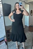 This dress is the perfect black wedding guest dress. The only reason I didnt go for this one for my friend's wedding was because it's a spring wedding so wanted a lighter color but I loved this dress on. Adjustable straps but the bows are not adjustable. Flattering cut on a curvy figure ! - Sydney B.