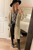I was waiting for this to restock in an XS because I read reviews that it ran large and Im glad I did. Even wearing an xs, its very large on me, but it just looks like an oversized fit. Super versatile, I wore it over every single outfit of mine on a recent trip, and got compliments on it from many people. - Jessie C.