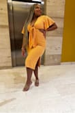 I bought this dress for a Mexico vacation and it was by far my favorite look! I love it so much I went back and bought the other colors!! It hugs in all the right places, and I am a curvy girl with a mom pudge and I NEVER thought I could wear tight dresses right now. But the cut of the dress with the ties in front is soooo flattering. Also, gives the boobs a nice perk up! - Camille P.