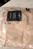 I am sad to say I returned this dress. When I opened the packaging I realized the dress I received does not match the color advertised online. The color isn't even "cream" it's tan/beige. Online there is nothing that says it's "peach cream". Disappointed in you Lulus... - Jenni S.