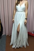The dress is exactly like in the pics! Super cute, elegant, simple but yet so beautiful! The cute tiny belt looks very classy. I am 66kg, 1.73cm tall, 90cm bust, 66cm waist, and 95 cm hips. I need to wear 6-7cm heels, otherwise, the dress touches a bit the floor  The size 6 fits me perfectly! The strings in the back can be very nicely adjusted. The dress is already padded so you don't even need a bra. Fully recommend! It came from the US to Japan in less than a week! Super impressive! Beautifully and carefully packed. The only thing it needs is some professional dry cleaning. - Gabriela C.