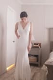 This dress had a very romantic feel and instantly had a beach wedding vibe. My wedding is in March, in New England so it doesn't feel right for the event, but in the summer this would be a great style. I love the wider strap and the neckline. I do lack in the curve department, so the very fitted look would have worked out better if I was fuller in the hips and backside. Still a very stunning dress. - Kiana G.