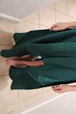 I'm a size 2 but when I order things online I order an xs because everything online runs big. This was a true xs meant for a size 0 or 1. I zipped it but it was close. I like the heavy, fancy material but the pleat is sewed off to the side so that your left leg is showing more than your right leg. I thought it was a mistake but now that I look at the models I see that all the dresses are like that. - Dani J.