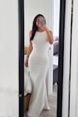This dress is so beautiful and it's a nice spot between sexy and classy. I understand that it is a fitted style but it does fit very small. I am typically a size 6 who's a little bit curvier around the chest and hips, and I just fit into a M. It is double line so it is not see-through. You can wear spanx if you are a little bit taller and it doesn't show in the back.
I am wearing 4-in heels in the photos and they just graze the floor, so no alternations are required - Daryl S.