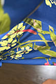The one thing I feel needs to be in this review that I didn't see in others is the color of this dress! In the review pictures it looks a bright Royal/cobalt and in the model pictures it looks navy! I'm here to tell you in the light it looks cobalt and out of the light navy, it's beautiful either way and fits well and is super silky and cannot be worn with a regular strapless bra though - Kristina N.