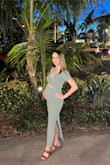Dress fits perfect for before and during pregnancy. Super comfortable and lightweight. I usually order XS or S but went with a S hoping the dress will grow with me. 20 weeks first pregnancy and I LOVE this dress! - Kristen O.