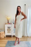 This is a unique little number in a warm cream color that flatters any skin tone. I love the crochet look, it adds a retro spin to the dress. Very ladylike from the front, then you turn to the side with the slits, all sass. I love the tassel detail on the belt. I also appreciate the modest neckline as my toddler climbs all over me, so this keeps things PG. This versatile midi dress hits all the right notes. Bonus: she's fully lined! See more @thestylestrudel - Sonja B.