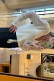 I had to wear a cami w this. It plunges very low. Adorable top!  I wore w the split-leg black pant from Lulus on my way to Mexico. Fit the occasion!! - Judi S.