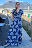 My go-to dress as soon as it gets even a little warm out. I have it in the navy blue floral and the light blue floral. 
The rayon fabric is super breathable and breezy. I got the dress in the light blue print and then loved it so much that I ordered again in the navy blue! 
Note that I think the solid colors are partially lined but the patterns are not (which I like. I'm always hot!). I placed safety pins in the bodice and the skirt to keep it modest, but I like that the pins weren't built in because I'm sure not everyone would want them in the same place. I think the flutter sleeves are very flattering for my broad shoulders and the wrap lets me adjust the fit. 
The length is perfect for tall girls like me, thank you, Lulus!
I love both blue dresses so much that I also ordered it in the red floral but found it just wasn't a good color for my coloring. - Jocelyn T.