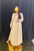 I have a large chest area so I got an XL. I'm short so the dress was too long for me even in heels so I had a friend trim it up for me.
I wore a silk camisole to cover up my chest but if you're bold or have a smaller chest than I do, a nice bralette or bra would work too. The part of the dress that joins just below my chest tends to open as I move so what I did is use double sided tape for fabrics to get them to stick even as I moved around. It worked and I enjoyed the night dancing and moving around. - Hana S.