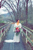 My daughter searched high and low for a dress that she had envisioned for her wedding. She wanted something that she hadn't seen every other bride wear. She found this dress and loved it. We had to have a few alterations done to the length. Other than the length it does fit on the snug side. It was a perfect dress for her! She was a beautiful bride!! - Tonya B.