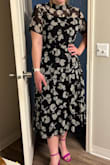 This dress is so cute! I love the unique neck-line and the length. The sleeves are a little tight on me and I am worried that the detail of the tiers gets lost in the black fabric, but overall it's super comfortable and works great! - Ryann H.