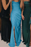 Loved this dress so much!! I bought it, and I thought it was going to be a satin material, but it's a Jersey material. I still ended up loving it! It was very very long, however, so make sure you have time to get it hemmed if you are short like me. I'm 5ft 4in and I wore 5in heels, so I was 5ft 9in and there was still about three or four inches dragging the ground. Also, the slit does not connect, so that's something to consider if you are prone to accidentally flashing! - Faith F.