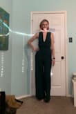 This is one of the most comfortable jumpsuits. And I absolutely love the deep plunge in the front. I love it so much I've worn it twice in less than a week! The bust is a little loose on me however sizing down seems it might be too tight around my hips and thighs. The color is stunning. I plan to order one in a different color. - Robin F.