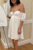 Bought this dress for my shower and it was exactly what I was looking for! The style was perfect but being a smaller chested girl I didnt wear a bra so unfortunately the top part kept sliding down as well as the sleeves so I was constantly having to readjust and pull up the dress. Otherwise it was perfect for the occasion. - Chloe C.