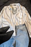 This blouse is cute. The black and white is perfect. I'll pair this with a chunky statement piece for even more drama, straight-leg blue jeans with a black bootie, and my blue coat from Lulus! - Maisha B.