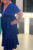 I wore this to a wedding.  The top was a bit big for me as I am not big chested.  I put one of my grandmother's broaches at the "V" to keep it closed.  I loved how comfortable it was!  No sucking in necessary and the sleeve coverage was great.  Basically, it was a dress that covered everything without looking frumpy!  I got tons of compliments and felt very pretty all night. - Leslie L.