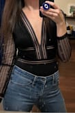 It's just the right amount of sexy! I wore it without a bra and it was perfect, you couldn't see anything. It's a bit tight when you lift your arms but I just unclasped it at the bottom and it was fine. Wore it with jeans, leather pants would look great too! - Olga S.