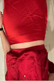 Skirt fits wonderfully, a very nice shape. The top didn't match at all which is very disappointing. I love the way they fit and look minus the reds not matching. - Elizabeth R.