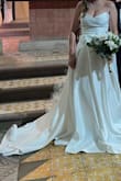 My waist and boobs looked amazing. It was a perfect fit. The leg opening was very high. I had to close it like 5cm. 
Other than that, the dress was beautiful.

Advice for anyone who is reading this; don't think about having your dress made. JUST BUY IT. - Evangelia V.