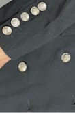 It was very disappointing. Material, in general, is not good quality. Buttons are shiny and look really bad. - Adriana M.