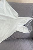 The dress is too loose. Another order was made for size Small. Dress has the tags and never been worn. - Erika C.