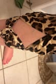 Buyer beware! I ordered this and got a similar romper, but it didn't have the slit up the leg. I set up the exchange and then they sent the wrong/different one AGAIN. The rep I chatted with insinuated it was my fault the slit wasn't all the way up my leg, since I'm tall and the hem falls on my calf instead of my ankle. Not sure how that changes the romper. Then when I went to return them, driving 40 minutes to the nearest UPS location, the label that I was told would have them print the label at UPS was invalid and I had to pay for the label and for them to tape up the original shipping bag. - Kristen M.