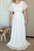Love this dress! Especially the flowy bottom and cut out back! A little long for 5'7" but heels fix that. The top is a little thinner of material than I would prefer but not going to stop me from wearing to my bridal shower! - Megan R.
