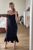 I'm 4 months post partum so I was really nervous to order this dress. So I got a medium instead of my normal size of a small. It's so forgiving and so beautiful! Maybe I could have gotten away with a small. You just need to wear a strapless bra with it or else your nipples could show through. It's a stunning dress for the price point ! - Kelsey S.