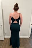 Very comfortable and form fitting. Perfect length for me being 5'9" with high heels. I have smaller breasts, but a wide back, so I felt like the buttons on the back were screaming& Ended up returning because I was scared the buttons would pop. Otherwise a stunning and beautiful dress.

Hugs curves nicely! Ended up going with an almost identical dress from Lulus, only difference was the back of the dress and the new one had a little more stretch. 

https://www.lulus.com/products/infinite-glory-forest-green-maxi-dress/511092.html - Rebecca A.