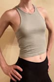 Pictures were very accurate. I was happy the XS was small enough for me because sometimes that's a problem with ribbed tanks. You'll need a good strapless bra or a lot of confidence because the material isn't thick enough to hide anything and the racerback is too thin to hide bra straps. - Christine L.