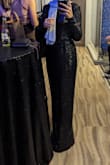 Dress fit like a glove. Nicely lined and has a good weight to it. I did accidentally match the tablecloths at the event that I was at, but the dress still looked great! The sequins don't look cheap against the fabric. - Khawla R.
