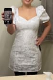 It's worth the money - it's well constructed and the fabric has a slight shine that is stunning in person. It looks very bridal so if you are looking for a rehearsal dinner or bridal shower dress this is a great option! - Kelly T.