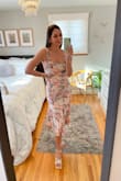 This dress is fun, flirty & flattering. It ties in the back so you can adjust the straps to your bust and waist (help will be required). The material is light & airy, it flows when you walk & the floral color scheme is lovely & easy to accessorize with. The midi length hits just right & my toddler can climb all over me & I'll still feel secure. It has this retro Italian glam vibe to it which I love! See how I styled it @thestylestrudel - Sonja B.