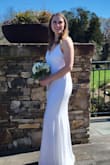 I wore this for a small elopement ceremony. I bought a large and it was a little loose in the chest area, but I didn't have time to see if a medium would fit me better. Overall, I love the material of the dress and how elegant it is. - Krista M.