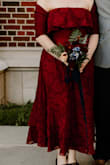 The material and construction of this dress was both comfortable and sturdy (which I absolutely need in a strapless dress for my sz 12 and 34DDD frame). Highly recommend! In the photos, I have a wrap over my shoulders. - Annelies H.