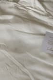 Beautiful dress but it came with a small black stain on the front that I need to try to remove since it's final sale/ no return. - Ngoc H.
