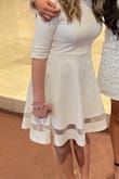 this fit perfectly on my 14yo daughter and was a beautiful and appropriate dress to wear to her 8th grade Catholic confirmation. It didn't wrinkle easy and was a thicker, soft, and non see-through material. - Addison D.