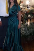 I wore this dress for a fall wedding and I absolutely love the emerald green color and the silky fabric. However, the line of underwear/any underclothes were easily seen. Also it was way too long and the opening in the front was too large. Had to pin it shut. Didn't get it tailored to fit properly so I kept stepping on my dress all night lol. It did leave a fun train behind be at least - Ashley D.